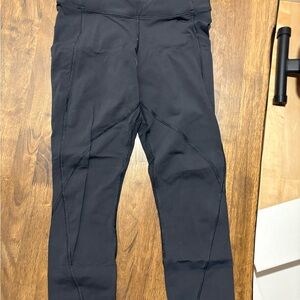 Lululemon black leggings with pocket and mesh details